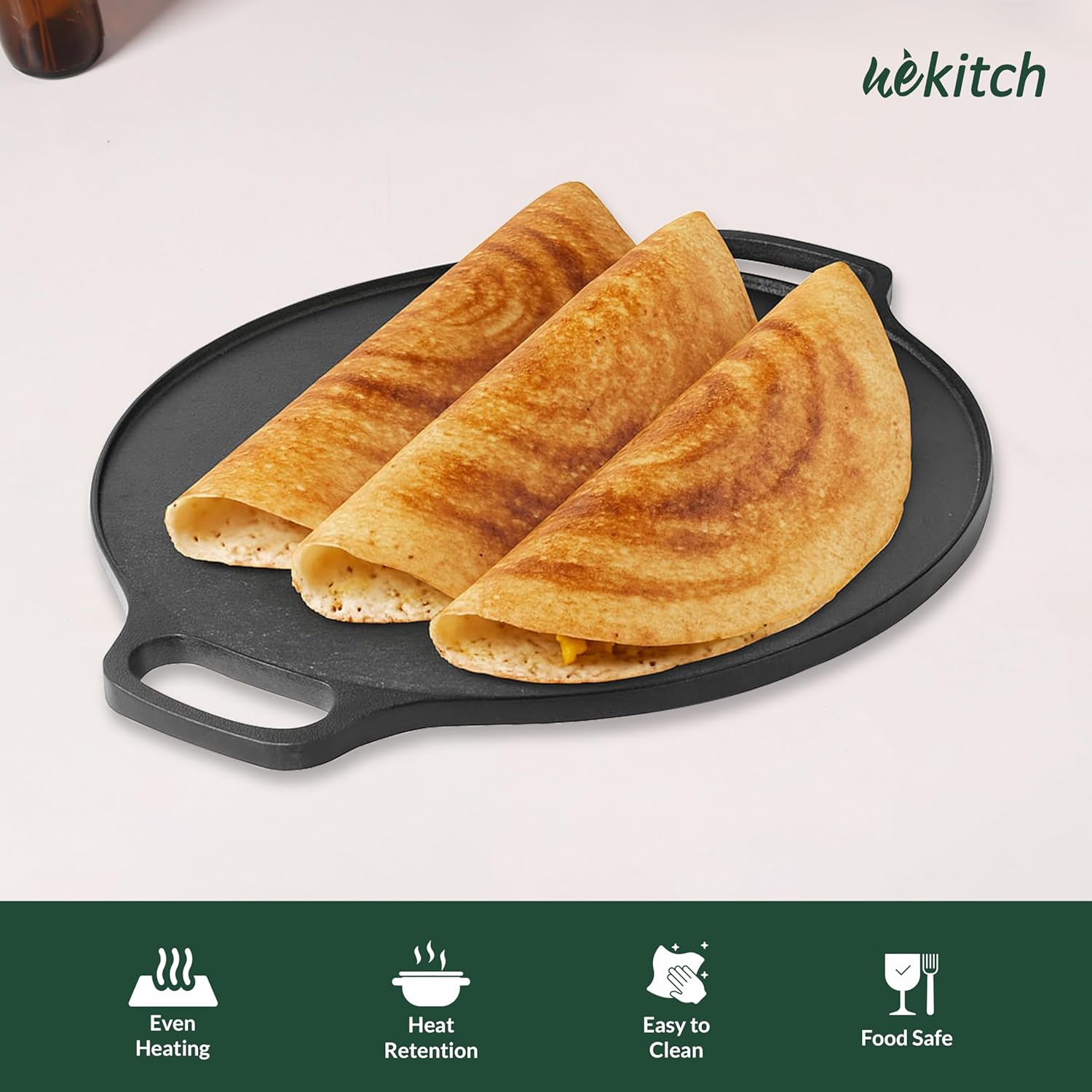 Three folded tortillas on a black tortilla press with 'Wekitch' branding.