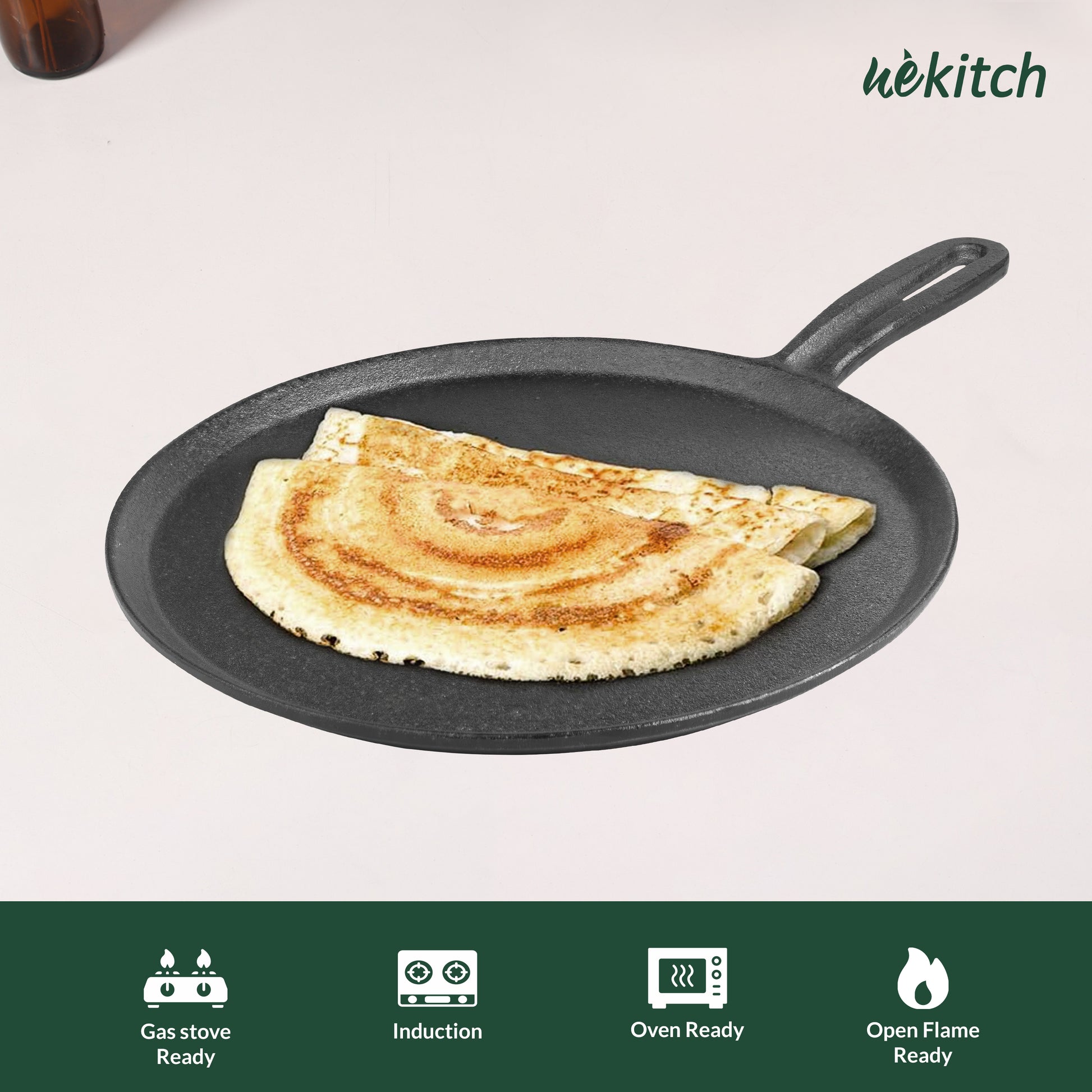 Black frying pan with a cooked pancake on a light background, featuring the 'wekitch' brand.