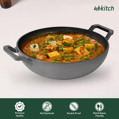 Curry dish in a black cast iron pan on a white background with 'wekitch' branding.